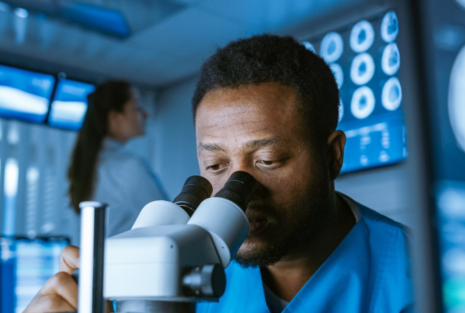 Doctor using a microscope