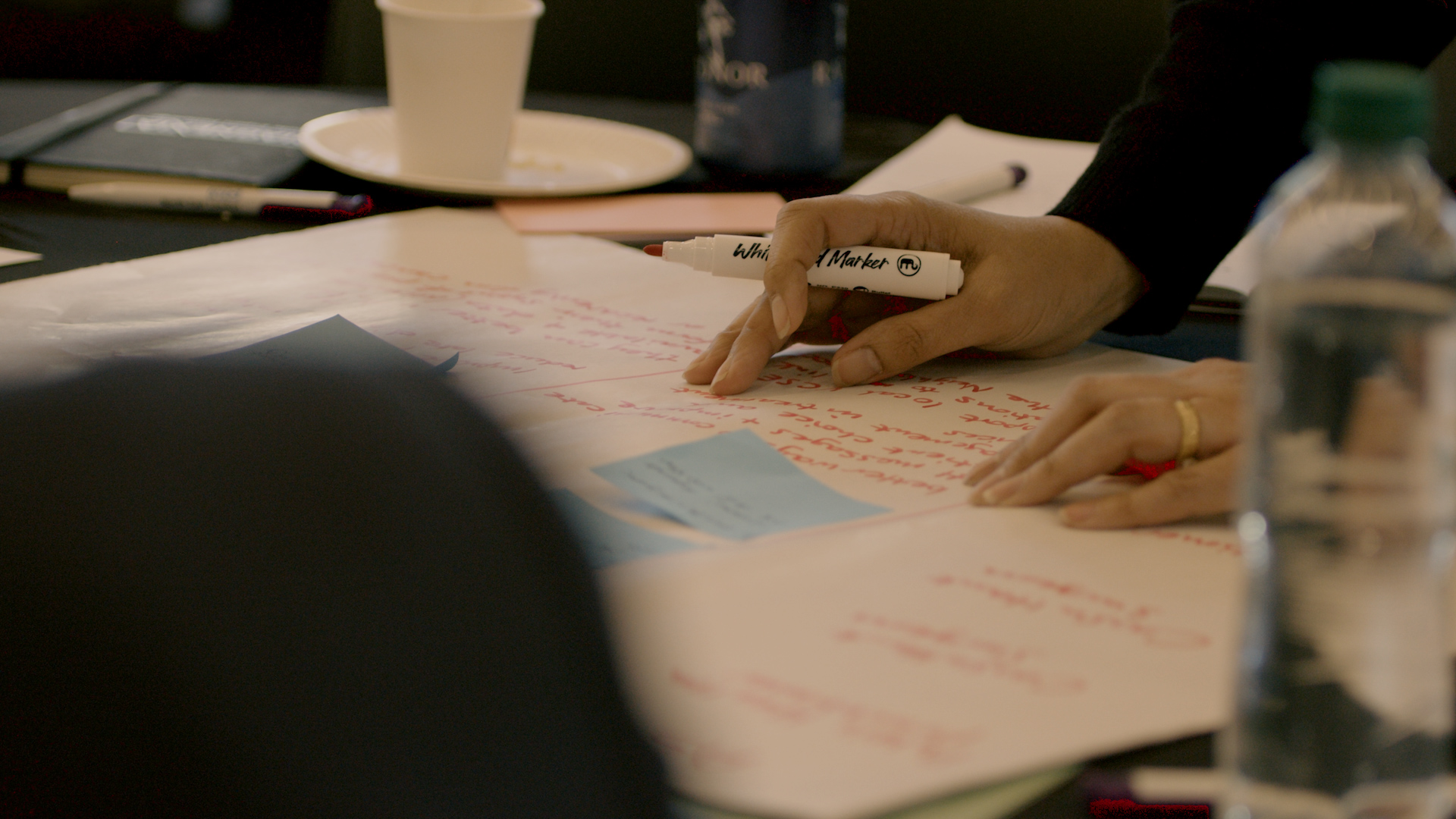 guests writing notes at the event
