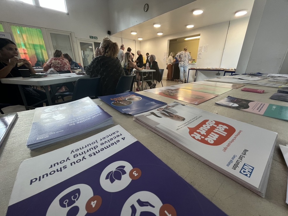 event table with informative flyers and leaflets