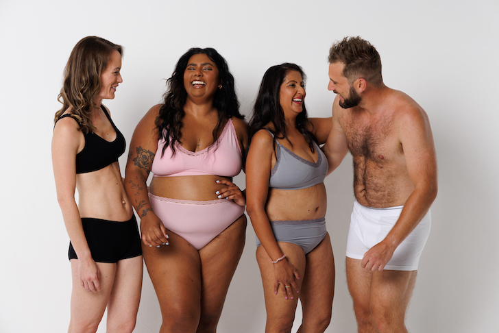 Three women and a man are modelling a new range of underwear.