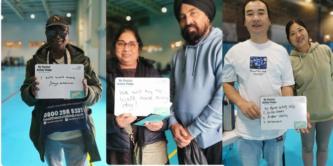residents holding white boards with pledges written down on how they will keep fit