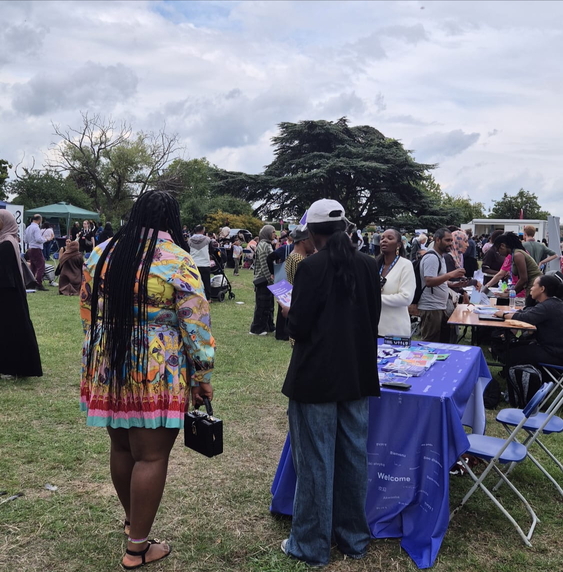 a crowd of people at a park 