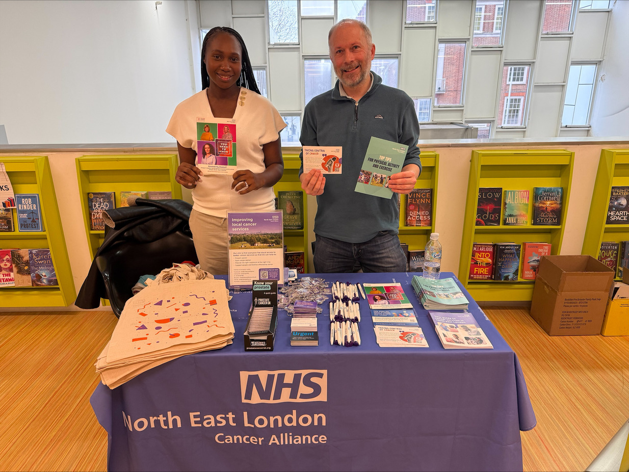 NELCA Staff standing behind informative stand