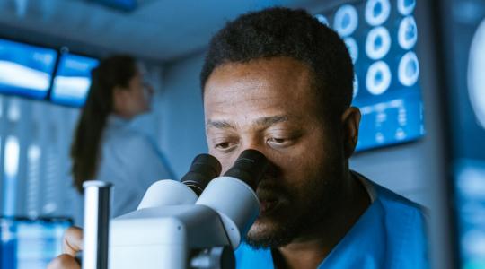 Doctor using a microscope