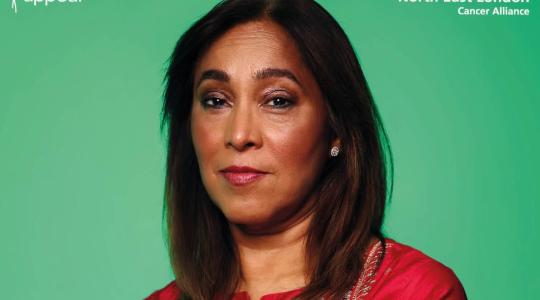 A lady is facing forwards against a green background. In the top left is the log for The Eve Appeal and in the top right is the logo for the North East London Cancer Alliance.