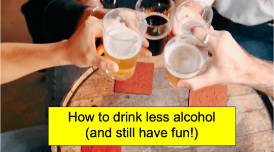 The image shows a group of people sat at a table in a pub bringing their glasses of alcoholic drinks together. The caption says 'How to drink less alcohol and still have fun'.