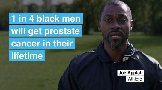 A black male is in a park in a tracksuit looking at the camera. To the left are the words '1 in 4 black men will get prostate cancer in their lifetime.