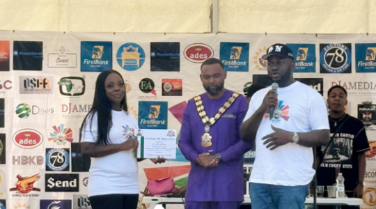 3 people on stage at the Nigeria festival 