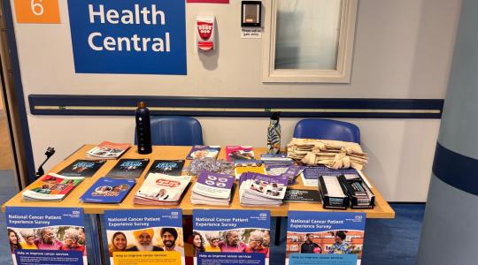 Table with informative leaflets on cancer awareness