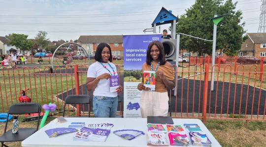 two people holding informative leaflet