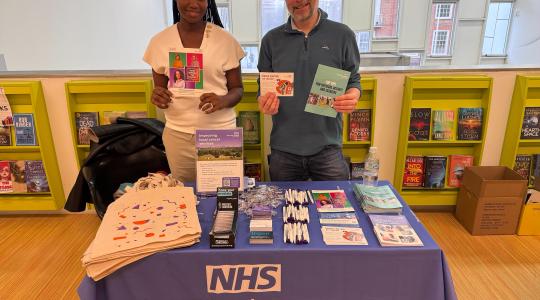 NELCA staff behind their stand