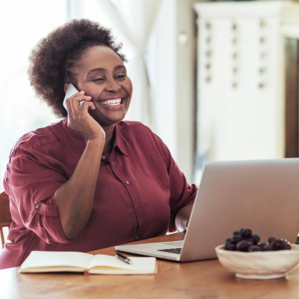 Person smiling and on the phone