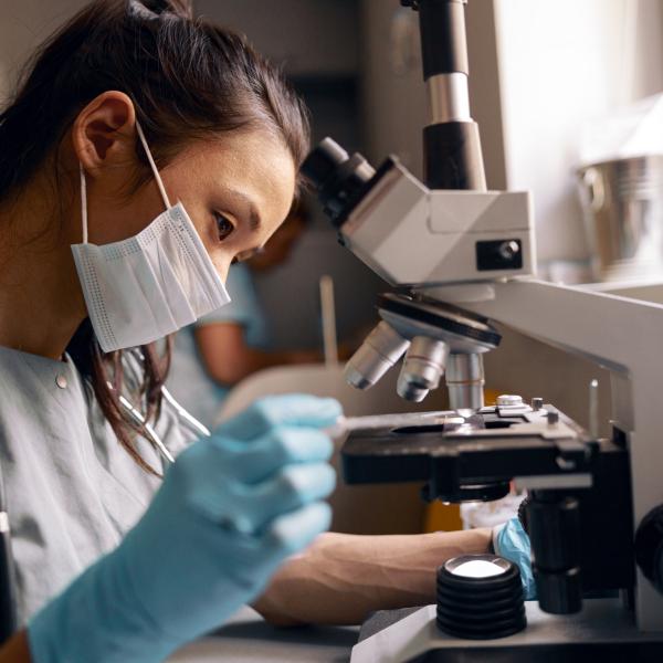 Doctor using a microscope